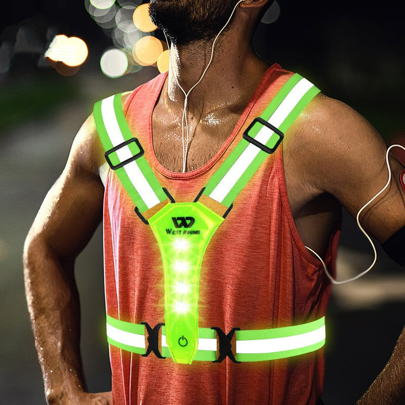 Person wearing a reflective safety vest with LED lights on a blurred background